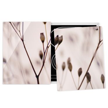Coprifornelli - Gemme scure su ramo di fiori selvatici