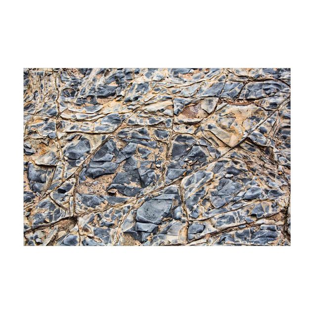 Tappeti effetto pietra Sotterranei rocciosi grigi sulla spiaggia