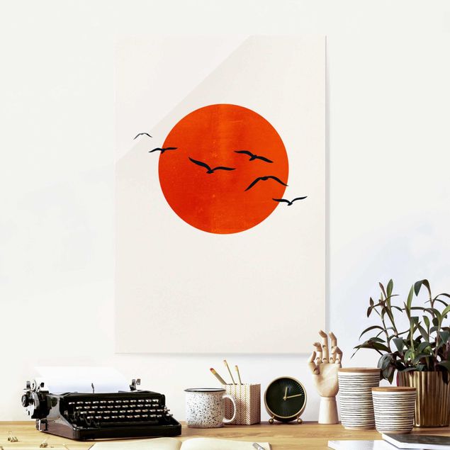 quadri con animali Stormo di uccelli di fronte al sole rosso I