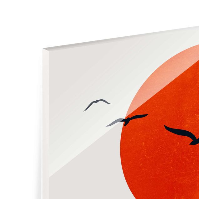Quadro in vetro - Stormo di uccelli davanti al sole rosso - Orizzontale 2:3
