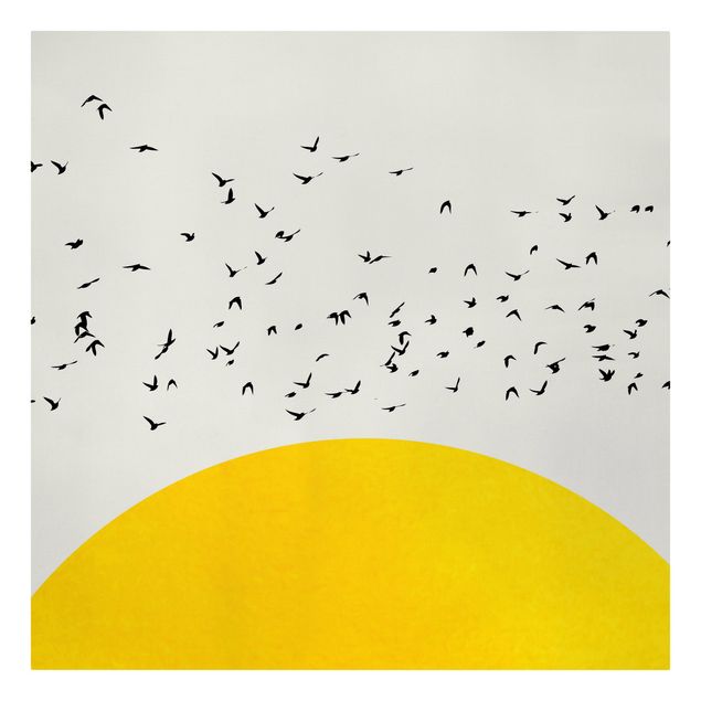 Riproduzioni su tela Stormo di uccelli di fronte al sole giallo