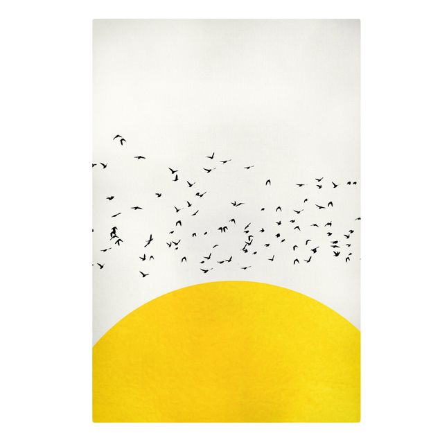 Riproduzioni su tela Stormo di uccelli di fronte al sole giallo