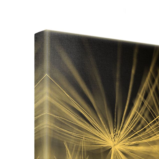 Quadro su tela oro - Primo piano di soffioni in movimento su sfondo nero