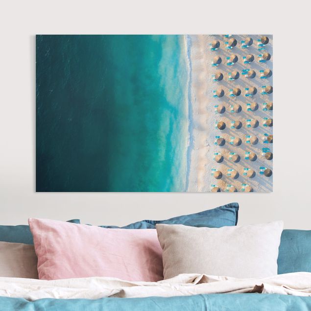 Quadri su tela paesaggio Spiaggia di sabbia bianca con ombrelloni di paglia