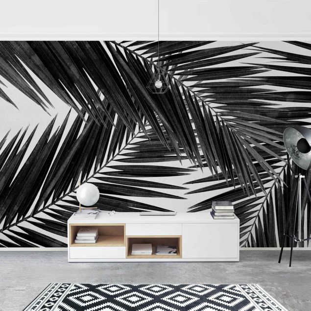 carta da parati per centri estetici Vista tra le foglie di palme in bianco e nero