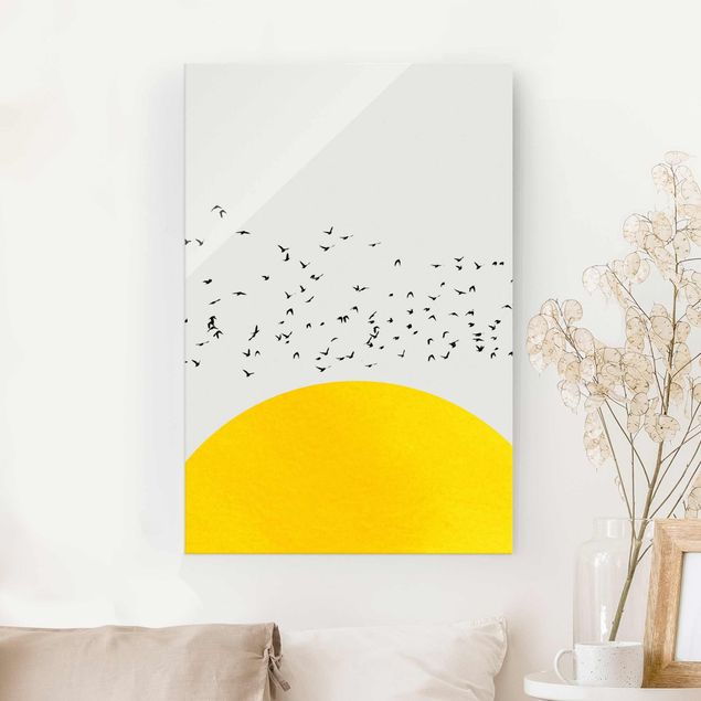 Quadri animali Stormo di uccelli di fronte al sole giallo