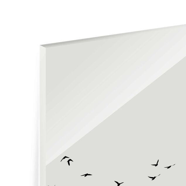 Quadro in vetro - Stormo di uccelli davanti al sole dorato - Verticale 3:2