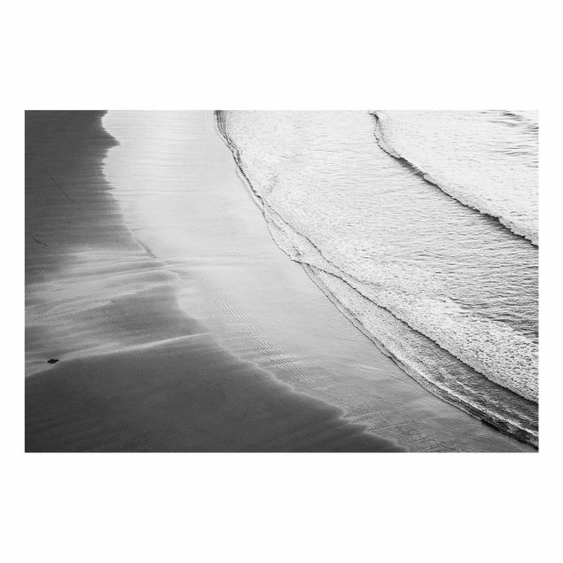 Quadro in vetro - Morbide onde sulla spiaggia in bianco e nero