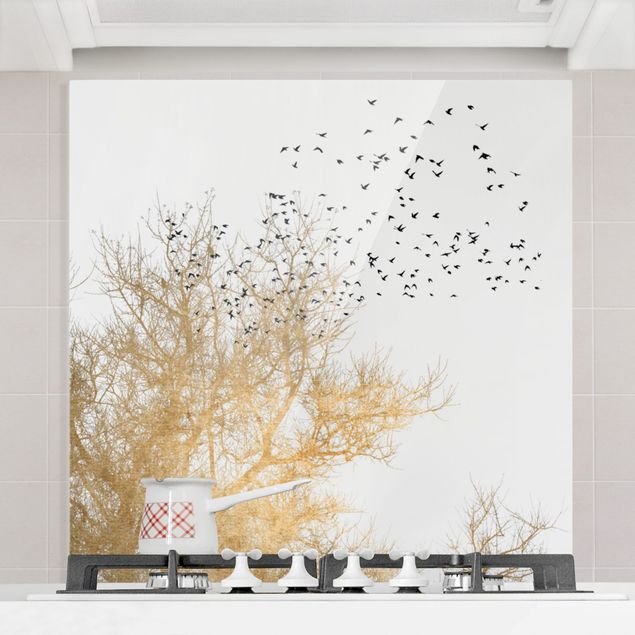 paraschizzi vetro magnetico Stormo di uccelli davanti all'albero d'oro