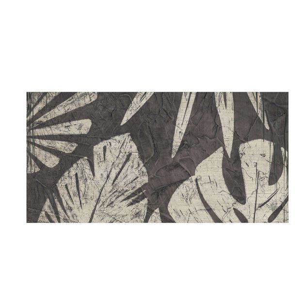 Tappeti grigi Sfondo grigio scuro con foglie di palma