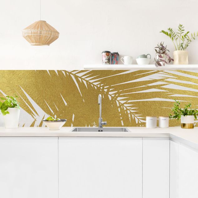 Rivestimenti cucina di plastica Vista attraverso le foglie di palma dorate