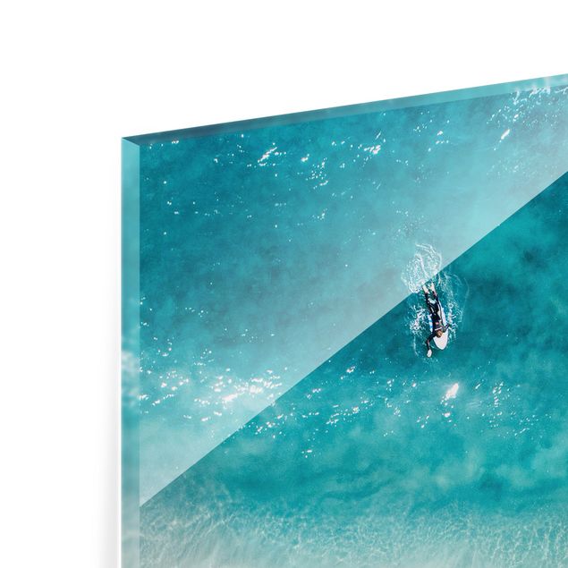 Quadro in vetro - Tre surfisti remano verso la riva