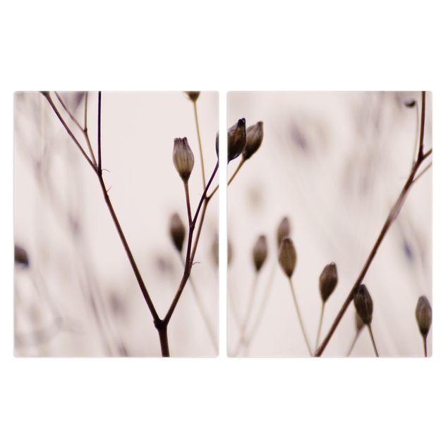 Coprifornelli - Gemme scure su ramo di fiori selvatici
