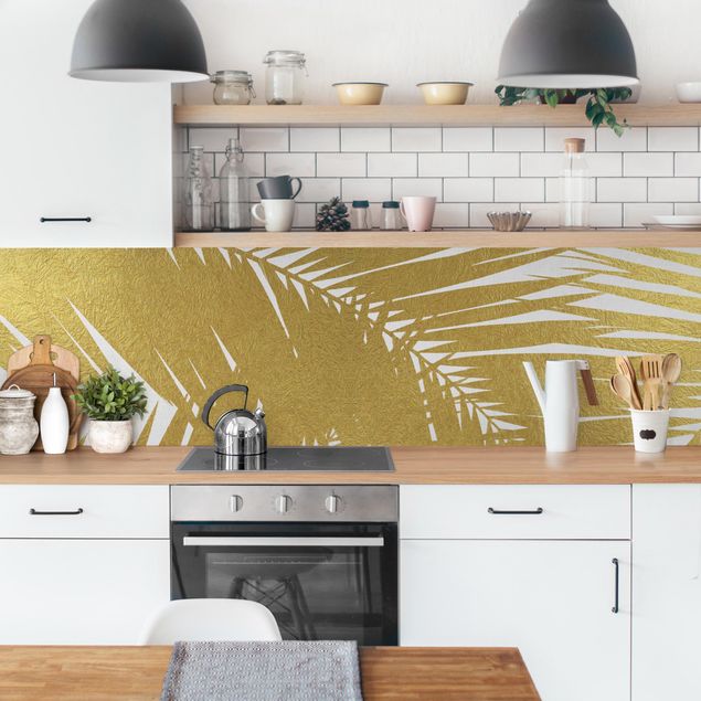 rivestimenti moderni cucina Vista attraverso le foglie di palma dorate