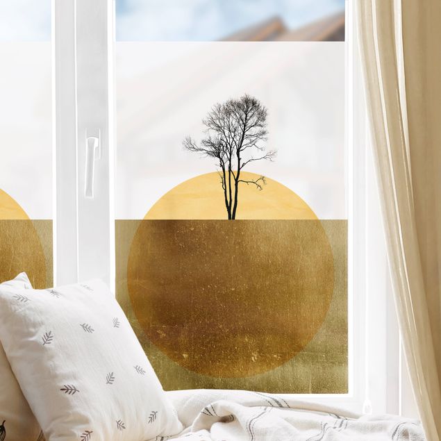Pellicola per vetri per salone Sole dorato con albero