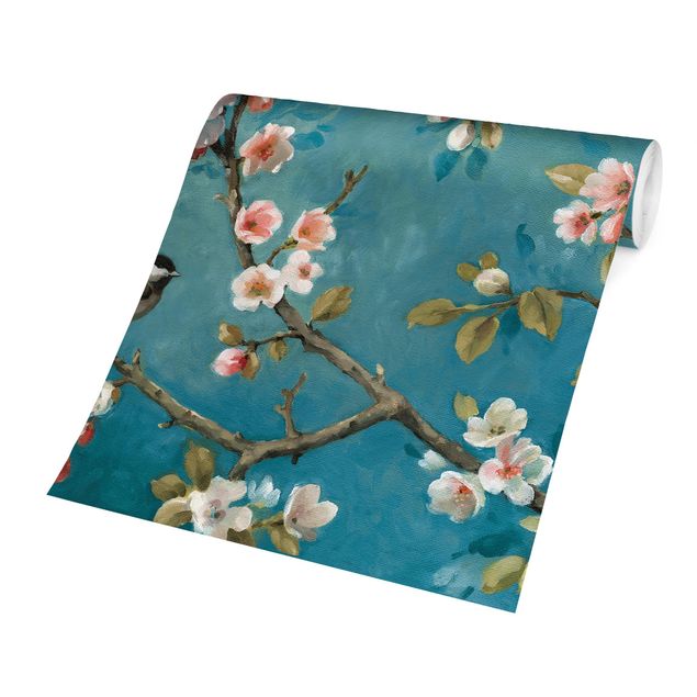 Carta da parati - Rami di ciliegio in fiore su sfondo blu