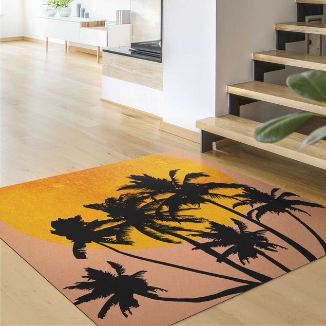 Tappeti floreali moderni Palme di fronte al sole dorato