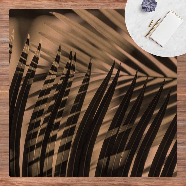 Tappeti moderni Giochi di ombre su ramo di palma