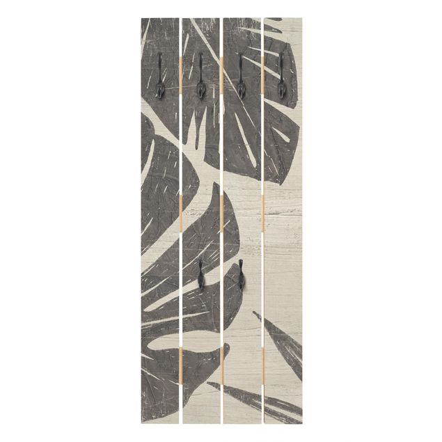 Appendiabiti in legno - Foglie di palma contro un grigio chiaro